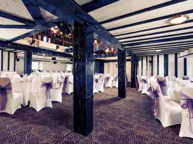 Historic wedding banquet venue at The Brasserie, Mercure Perth with prominent structural pillars.