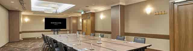 Mercure Perth boardroom: professional meeting space with AV equipment for corporate events.