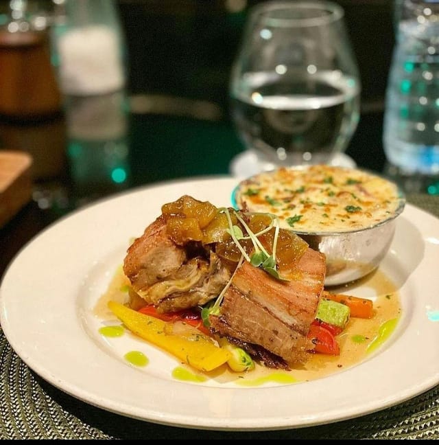 Gourmet entree with au gratin at Noir Lagos, perfect for upscale corporate dinners and galas.