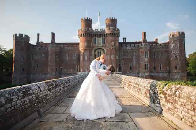 Luxury wedding venue at Herstmonceux Castle featuring elegant ballroom architecture.