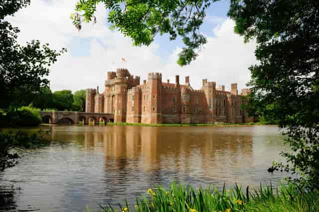 Herstmonceux Castle cloisters, an exclusive heritage venue for luxury gala dinners and events.