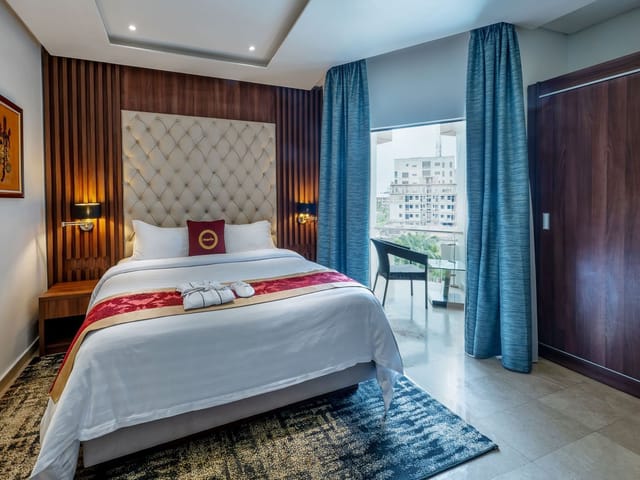 Classic Room at The Lilygate Lagos with workspace balcony for corporate business travel booking.
