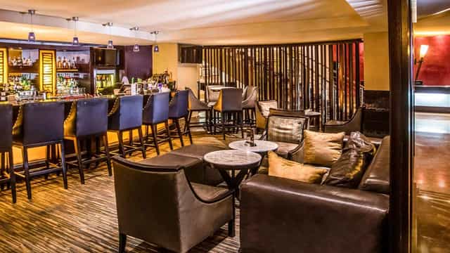 Sophisticated hotel lounge with bar seating for corporate networking and business events in Lagos.