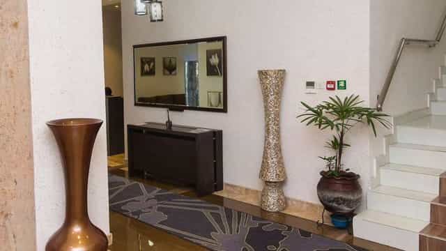Golden Tulip Oniru meeting room pre-function area for corporate event registration and conferences.