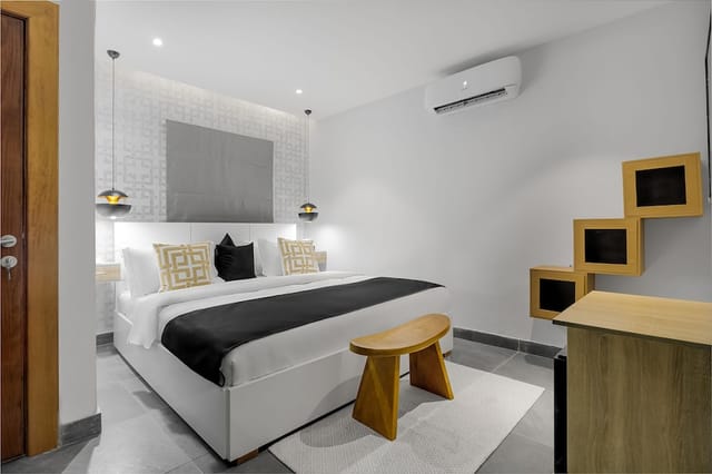 Modern minimalist hotel room at Villa 24, ideal for corporate travel and business stays.