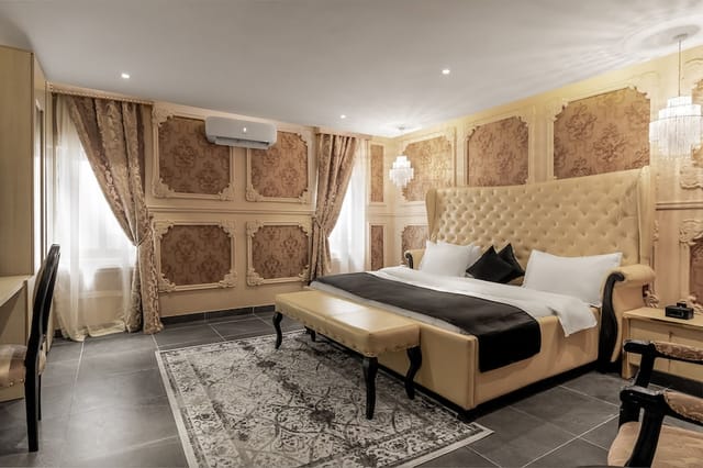 Luxury boutique hotel conference room with tufted headboard for VIP incentive travel.