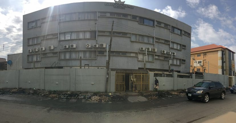 Outdoor event space at Kilo Royal Hotel with unmaintained grounds for corporate meetings.
