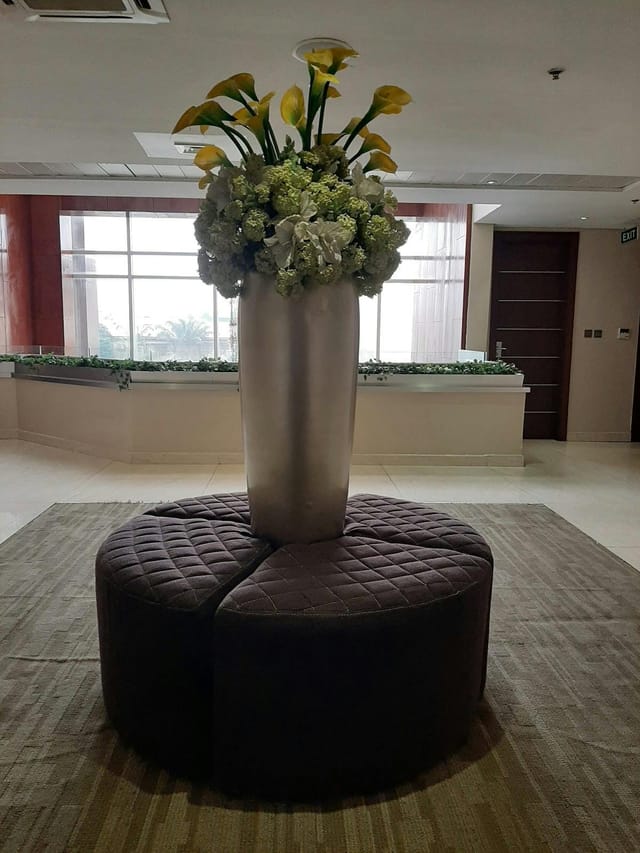 Circular ottoman in Pearlwort Hotel & Suites PW Hall event pre-function space.