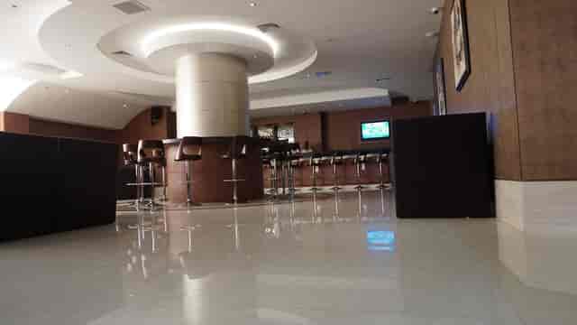 Modern hotel lounge with high-top seating for corporate networking and business event hosting.