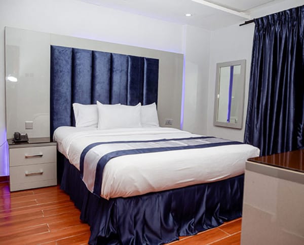 Kaduna Hall hotel room, mid-scale corporate lodging for event attendee accommodation.