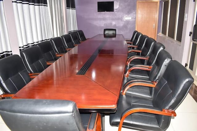 FAMS Embassy Suites boardroom with large table for corporate meetings and event planning.