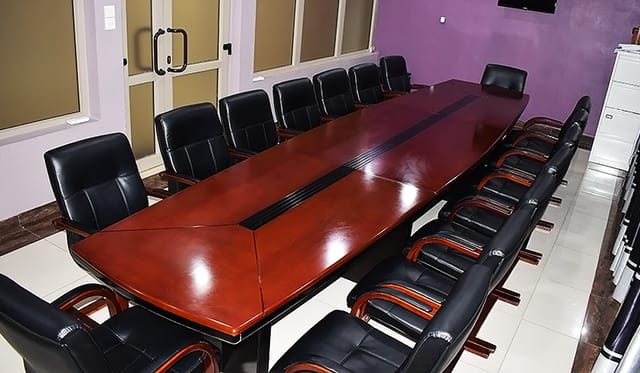Mahogany boardroom at FAMS Embassy Suites for executive meetings and corporate events.