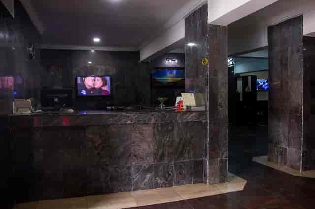 Dimly lit reception desk at Eastgate Hotel Lekki, ideal for event registration and corporate venues.