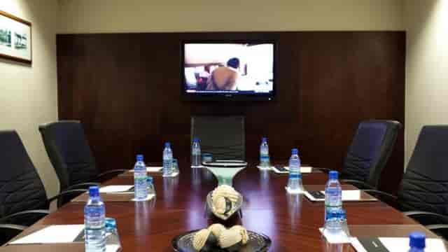 Executive boardroom at Chelsea Hotel Ikoyi, featuring AV setup for corporate meetings and events.