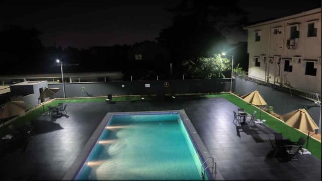 Poolside meeting room at BON Hotel Ikeja Residence for evening networking and corporate events.