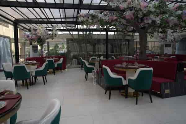 Euphoria dining terrace with red and teal decor for networking dinners and social events.