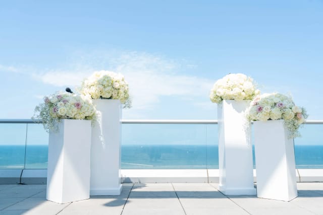 Minimalist waterfront wedding ceremony at WaterWood Lago Custom Events terrace.