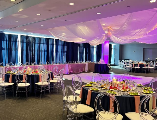 Riviera Ballroom event setup with navy and blush decor, perfect for elegant wedding receptions.