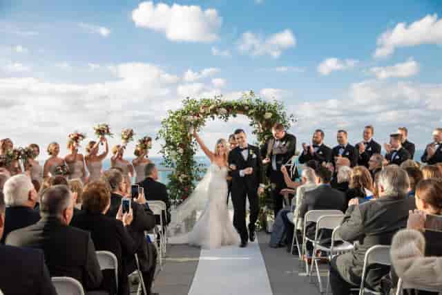Riviera Ballroom waterfront outdoor wedding venue with clear sky and natural light.