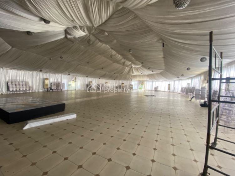 Spacious Canyon Lekki event marquee with ceiling draping for gala receptions and conferences.
