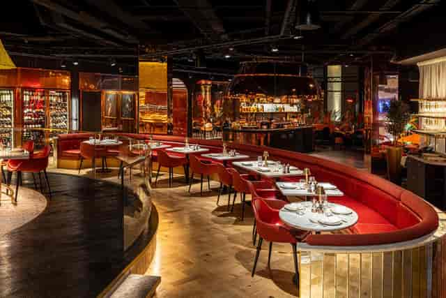 Duck & Waffle Edinburgh private dining space with red curved banquettes for corporate events.