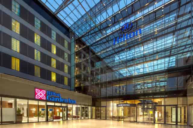 Hilton Frankfurt Airport atrium and meeting rooms for professional networking and event venue.