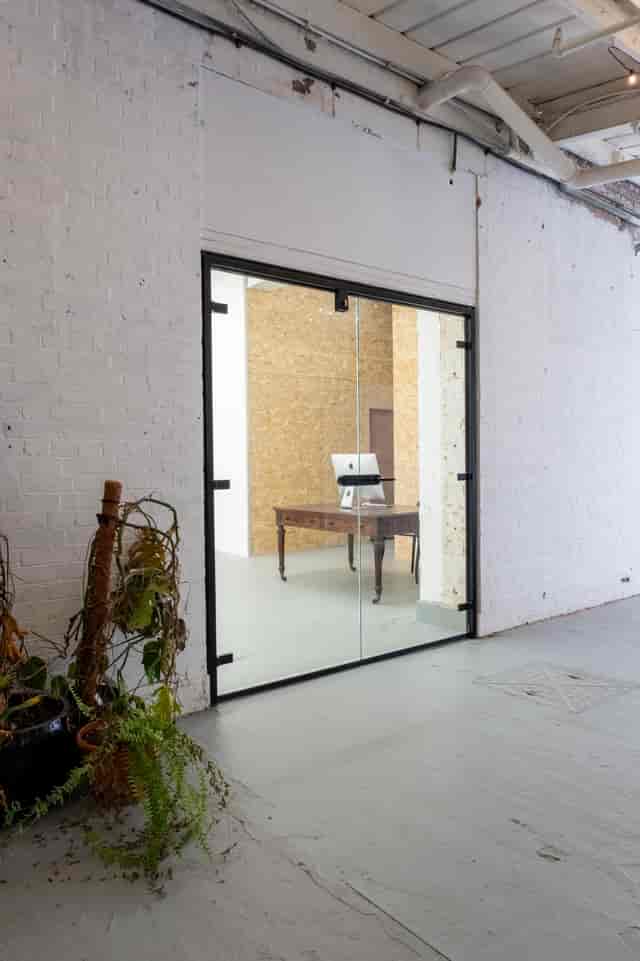 Industrial-chic breakout room at Orsman Road Studios for VIP planning and private consultations.