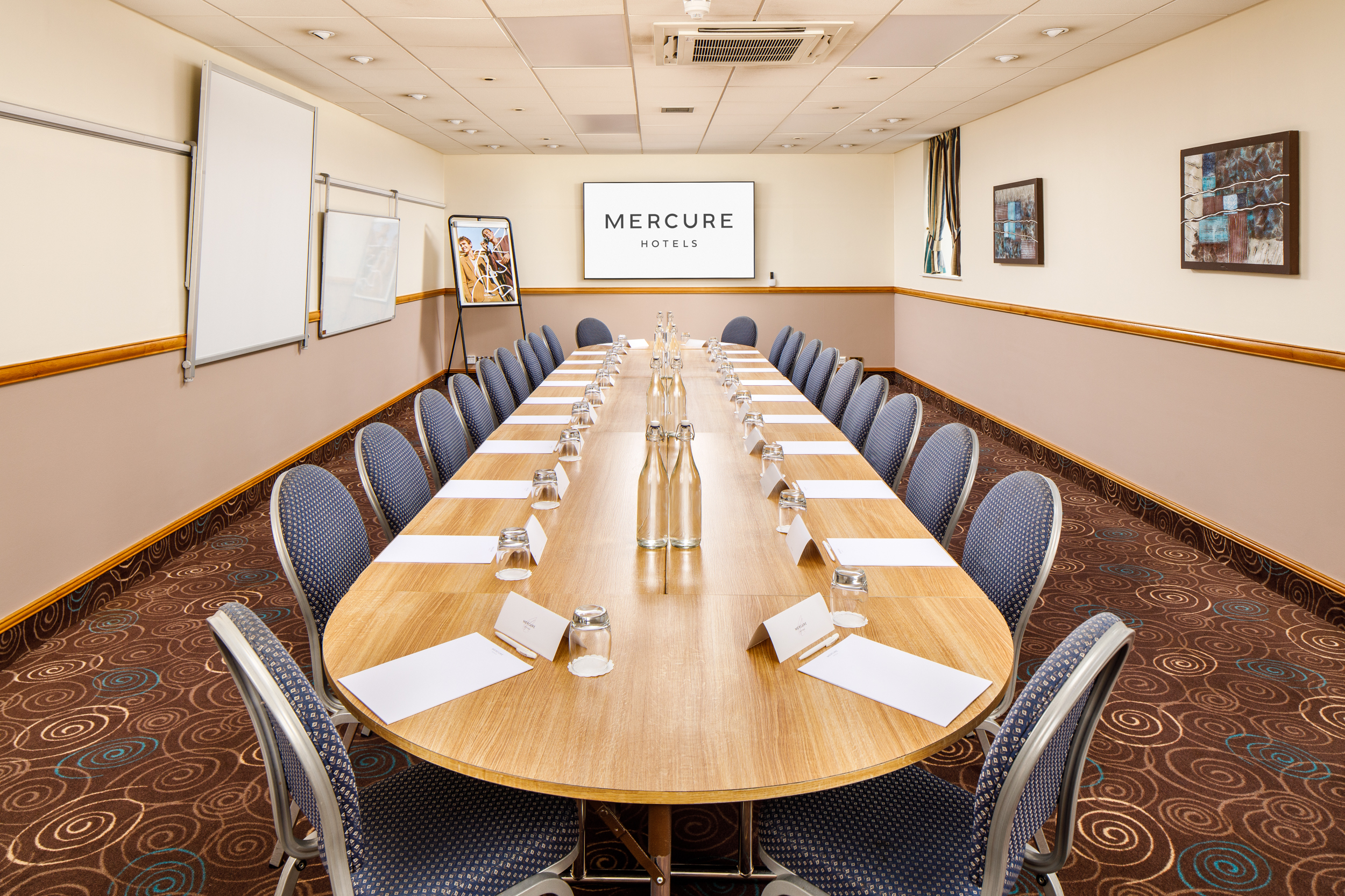 Boardroom setup in The Broker Suite, Mercure Glasgow City for team meetings and strategic workshops. - Banner
