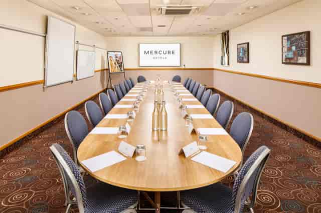 Boardroom at Mercure Glasgow City Hotel: oval table setup for business meetings and conferences.