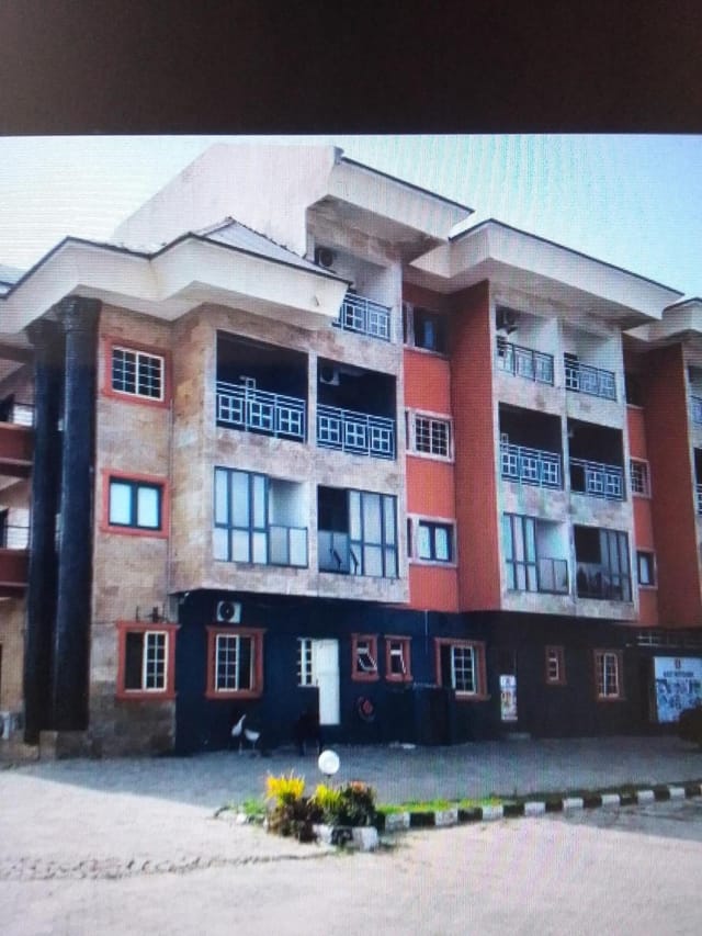 Blue Moon Beach Hotel outdoor event area with vintage multi-story architecture for rustic weddings.