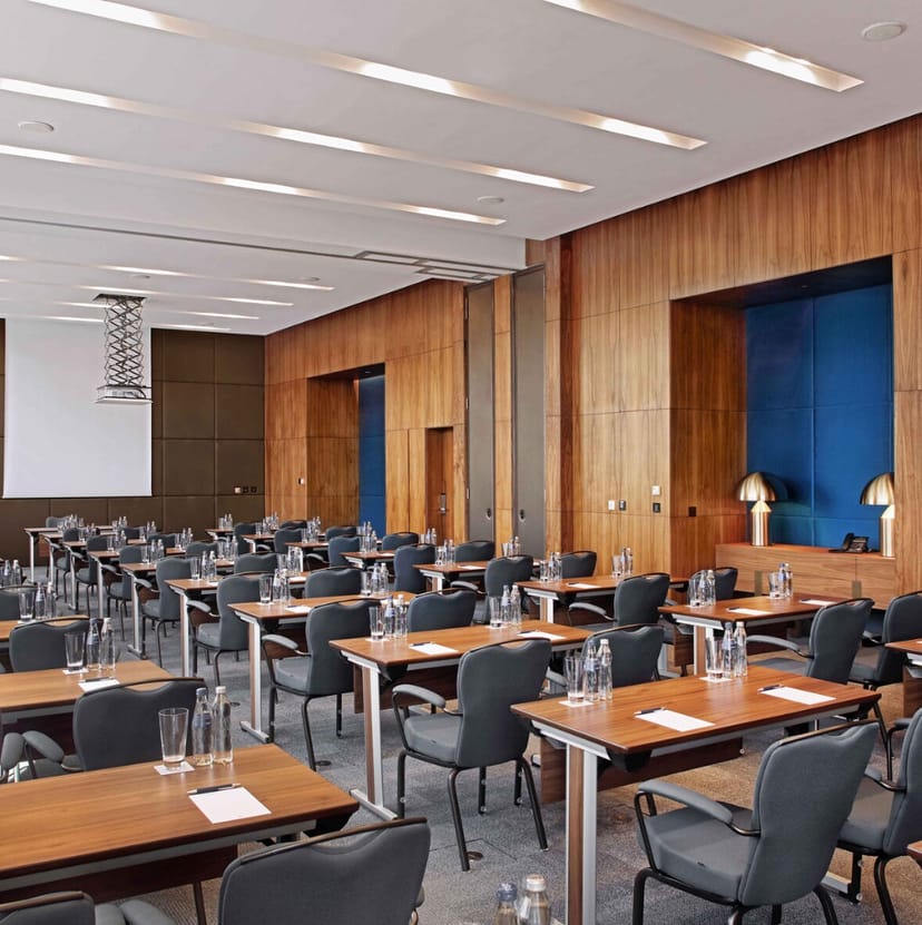 Baiterek Sheraton boardroom with wood panels for corporate training and business meetings.