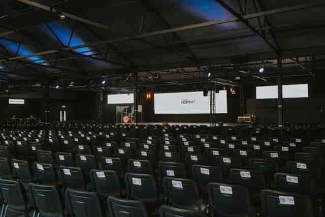 Main Auditorium at Events North: Industrial theater-style venue for corporate presentation events.