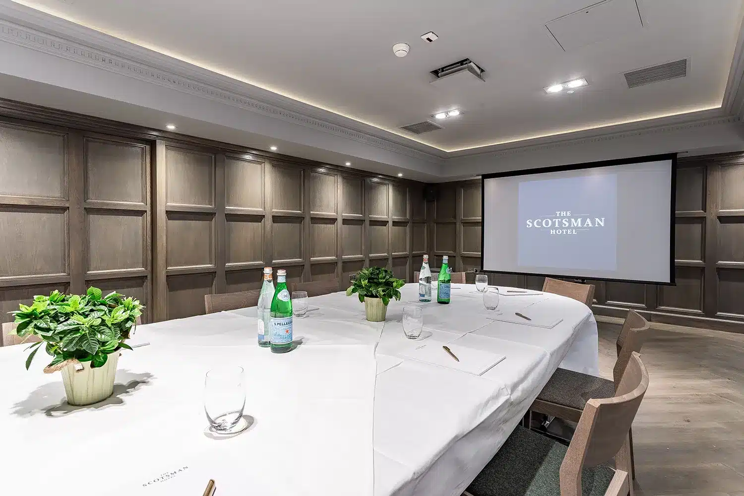 Boardroom at The Scotsman Hotel with wood paneling for executive meetings and private workshops. - Banner