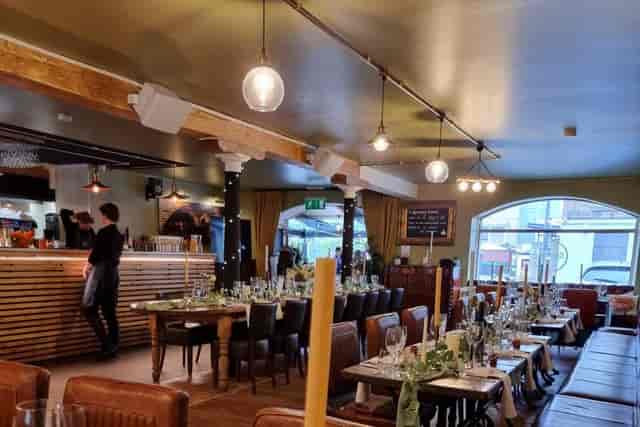 Rustic-chic Season Quayside event space with ambient lighting for networking dinners or parties.