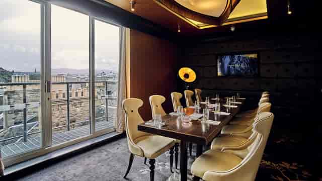 Upscale private dining room with urban views for executive meetings and VIP events.