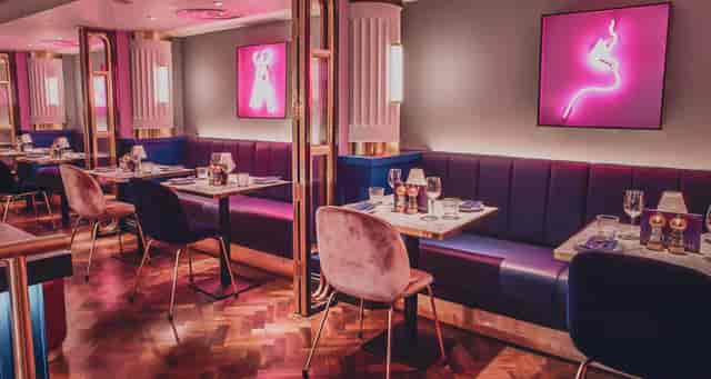 Le Monde Hotel lounge with neon lighting, perfect for VIP dinners and networking events.