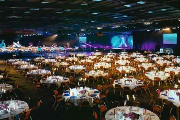 Gala setup with circular tables at Royal Highland Centre indoor arena for corporate events.