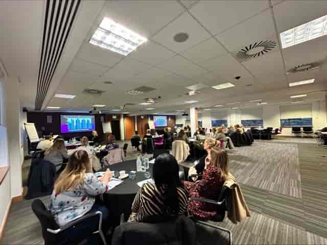 Corporate workshop at COSLA Conference Centre with round tables for collaborative event planning.