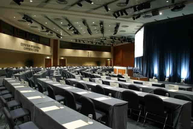 Classroom-style conference center with theater lighting for corporate events and professional lectures.