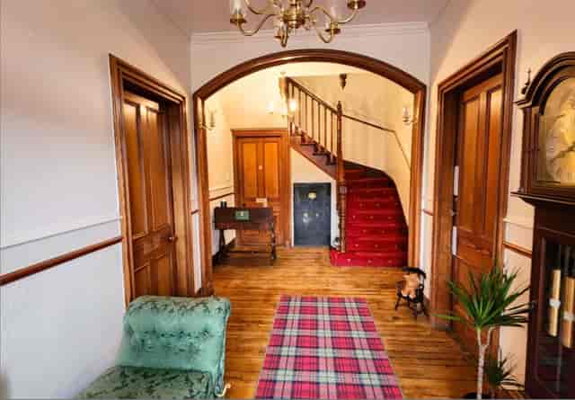 The Retreat Hotel entrance: heritage venue with wood staircase for boutique event hire.