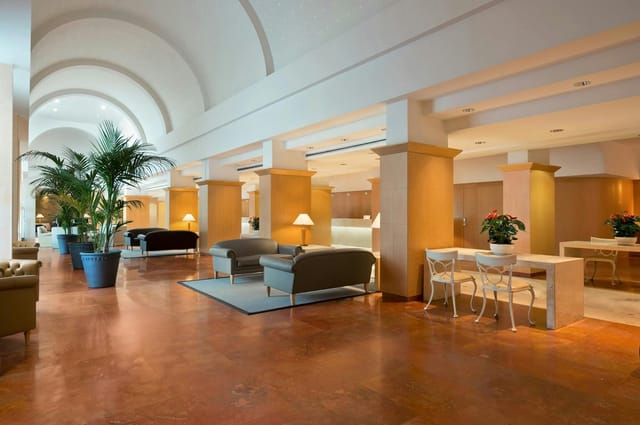Hilton Rome Airport banquet hall with lounge seating for conferences and networking events.