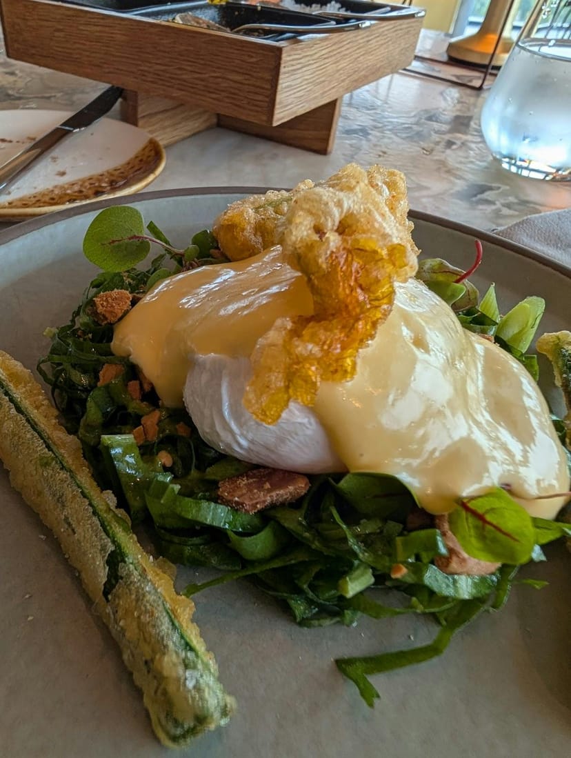 Poached egg breakfast entrée for executive luncheon and VIP brunch catering.