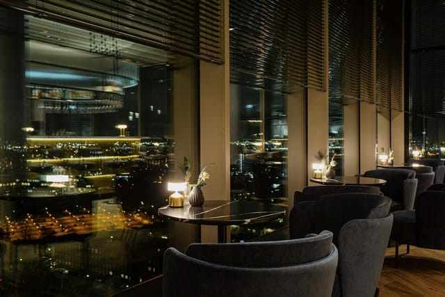 Luxury rooftop restaurant lounge for exclusive executive networking and VIP corporate events.