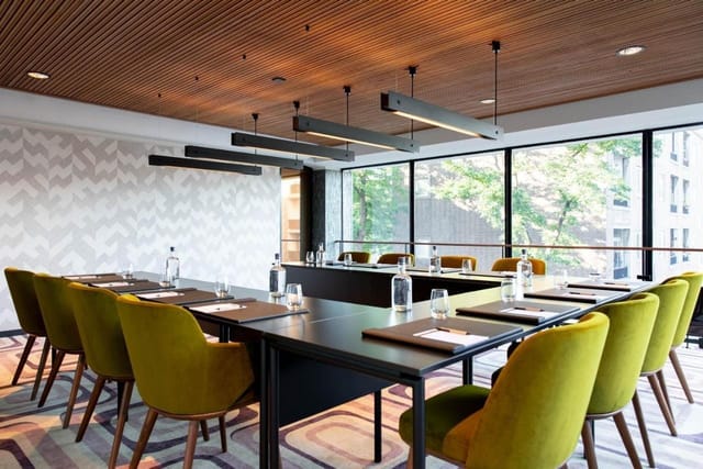 U-shape boardroom at Fletcher Hotel Rotterdam, modern meeting space for corporate events.