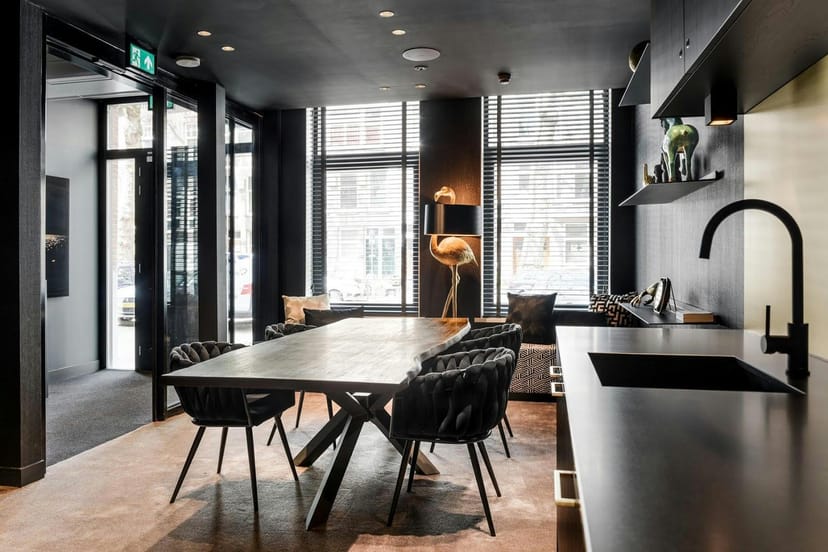 Luxury boardroom meeting suite with kitchenette, Le Marin Hotel Rotterdam for corporate events.