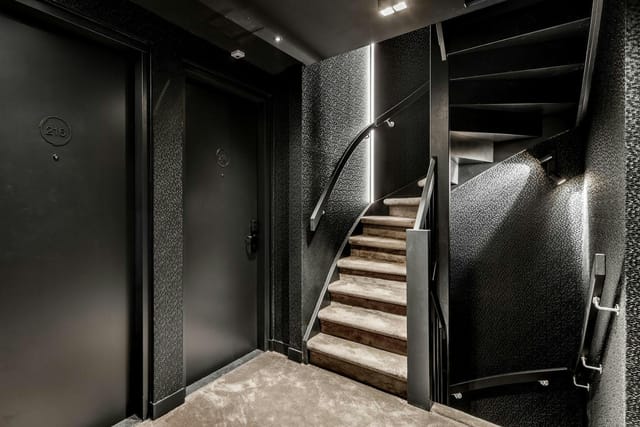 Moody Le Marin Hotel Rotterdam corridor with textured walls, ideal for boutique event guest blocks.