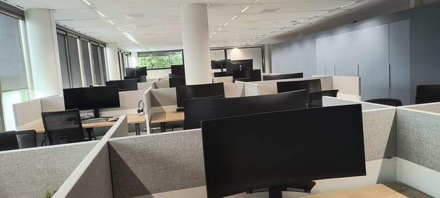 Modern office space in The Mark featuring open layout for corporate meeting event venue rentals.
