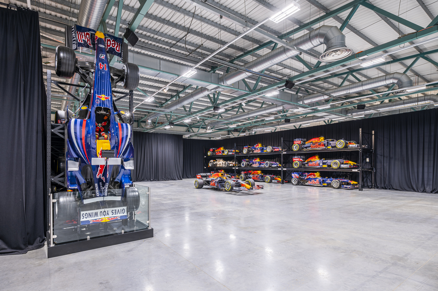 Dynamic MK-7 Warehouse event space with Red Bull racing car for corporate events.