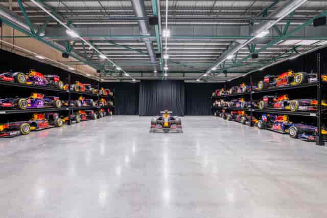 MK-7 Warehouse venue with Formula 1 cars, ideal for corporate events and product launches.