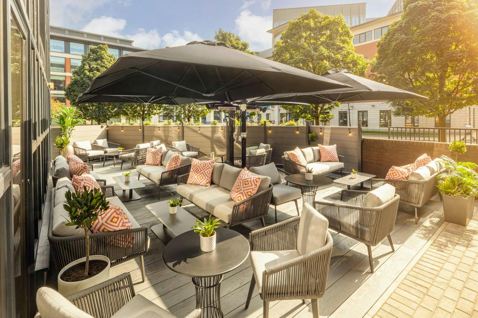 Outdoor breakout space with modular lounge seating at Crowne Plaza Leeds for corporate networking. - Banner